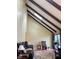 Bright living room with vaulted ceilings and exposed beams, creating a warm atmosphere at 4214 Woodsage Trce, Indianapolis, IN 46237