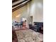 Open-concept living room with a dining area and kitchen access, perfect for modern living at 4214 Woodsage Trce, Indianapolis, IN 46237