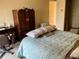 Main bedroom with bed, desk, and armoire at 4214 Woodsage Trce, Indianapolis, IN 46237