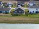 Aerial view of the property, showcasing its location and proximity to nearby water and community homes at 462 N Crystal Dr, Fortville, IN 46040