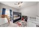 Bright bedroom with a bunk bed, a ceiling fan and a view from the window at 462 N Crystal Dr, Fortville, IN 46040