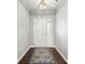 Inviting foyer featuring hardwood floors, a chandelier, and a decorative rug at 462 N Crystal Dr, Fortville, IN 46040