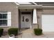 Close up of a home's front door with a wreath and decorative columns at 462 N Crystal Dr, Fortville, IN 46040
