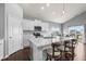 Modern kitchen featuring marble countertops, white cabinets, and stainless-steel appliances at 462 N Crystal Dr, Fortville, IN 46040