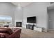Cozy living room featuring a fireplace, TV, and comfortable seating for relaxation at 462 N Crystal Dr, Fortville, IN 46040
