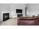 Living room with fireplace and TV, providing a cozy and modern space at 462 N Crystal Dr, Fortville, IN 46040