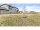 Backyard of the property with a well-maintained lawn, sparse vegetation, and a few young trees at 4763 Denton Dr, Zionsville, IN 46077