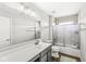 Well-lit bathroom with a large mirror, modern vanity, and glass-enclosed shower at 4763 Denton Dr, Zionsville, IN 46077
