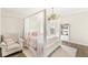 Serene bedroom with a canopy bed, armchair, and bright natural light from the window at 4763 Denton Dr, Zionsville, IN 46077