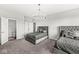 Bedroom with two beds, a stylish chandelier, and access to an ensuite bathroom, providing convenience and privacy at 4763 Denton Dr, Zionsville, IN 46077