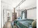 Charming bedroom featuring a four-poster bed, desk, and en-suite bathroom at 4763 Denton Dr, Zionsville, IN 46077