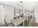 Dining room with modern lighting open to kitchen, living room and staircase at 4763 Denton Dr, Zionsville, IN 46077