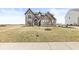 Stunning view of a two-story brick home with an expansive front yard at 4763 Denton Dr, Zionsville, IN 46077