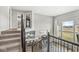 Open-concept living area featuring a staircase, kitchen, and large windows at 4763 Denton Dr, Zionsville, IN 46077