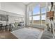 Open concept living space with large windows, comfortable seating, and view into the dining area and kitchen at 4763 Denton Dr, Zionsville, IN 46077