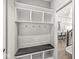 Mud room with built-in storage, bench, and coat hooks, seamlessly integrated into the home's design at 4763 Denton Dr, Zionsville, IN 46077