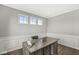 Bright home office with large windows, hardwood floors, white wainscoting, and a modern desk at 4763 Denton Dr, Zionsville, IN 46077