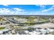 Wide aerial view of a racetrack complex with grandstands and track infrastructure under a bright sky at 4933 Ford St, Indianapolis, IN 46224