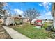 Backyard showcasing a shaded pergola, seating area, and well-maintained landscaping at 4933 Ford St, Indianapolis, IN 46224