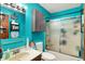 Cozy bathroom with a walk-in shower, sleek fixtures, and a floating cabinet for stylish storage at 4933 Ford St, Indianapolis, IN 46224