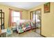 A charming bedroom featuring neutral walls, plush carpeting, and a whimsical bed with a sheer canopy at 4933 Ford St, Indianapolis, IN 46224
