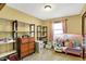 Bedroom features a window and cozy play area at 4933 Ford St, Indianapolis, IN 46224