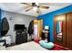 Bedroom with a ceiling fan and a walk in closet at 4933 Ford St, Indianapolis, IN 46224