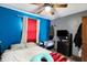 Bedroom featuring a ceiling fan and colorful décor at 4933 Ford St, Indianapolis, IN 46224
