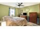 Bedroom with a large window and wooden furniture at 4933 Ford St, Indianapolis, IN 46224