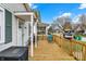 Outdoor porch area with seating, grill, and views of the street at 4933 Ford St, Indianapolis, IN 46224