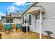 Inviting front porch featuring rocking chairs, a small table, and classic home exterior details at 4933 Ford St, Indianapolis, IN 46224