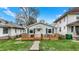 Charming single-story home with a welcoming wood porch and well-maintained lawn at 4933 Ford St, Indianapolis, IN 46224