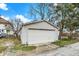 Detached garage with a white exterior, offering convenient parking and additional storage space at 4933 Ford St, Indianapolis, IN 46224