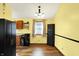 Kitchen with stainless steel appliances, wood cabinets, a window and wood-look vinyl floors at 4933 Ford St, Indianapolis, IN 46224