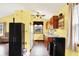 Well-lit kitchen area showcasing a window, wooden cabinetry, and essential appliances at 4933 Ford St, Indianapolis, IN 46224