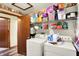 This well-organized laundry room featuring new washer and dryer units at 4933 Ford St, Indianapolis, IN 46224