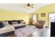 Inviting living room featuring a plush sectional sofa, hardwood floors, and access to the outdoors at 4933 Ford St, Indianapolis, IN 46224