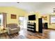 Bright living room featuring hardwood floors, neutral walls, and access to the outdoor patio at 4933 Ford St, Indianapolis, IN 46224