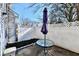A cozy outdoor space with a table and umbrella, nestled within a private fenced-in patio area at 4951 Tuscany Ln, Indianapolis, IN 46254