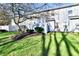 Spacious backyard with mature trees, manicured landscaping, and ample space for outdoor activities and relaxation at 4951 Tuscany Ln, Indianapolis, IN 46254