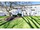 Lush green backyard with mature trees and landscaping, offering a peaceful and private outdoor retreat at 4951 Tuscany Ln, Indianapolis, IN 46254
