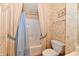 Comfortable bathroom with tiled walls, a shower curtain, and a toilet at 4951 Tuscany Ln, Indianapolis, IN 46254