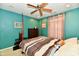 Brightly painted bedroom featuring a four-poster bed, neutral carpet, ceiling fan and dresser at 4951 Tuscany Ln, Indianapolis, IN 46254