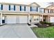 Charming townhome with a two-car garage, well-manicured lawn, and inviting curb appeal at 4951 Tuscany Ln, Indianapolis, IN 46254