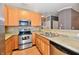 A well-equipped kitchen features stainless steel appliances and plenty of counter space at 4951 Tuscany Ln, Indianapolis, IN 46254