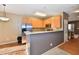 The kitchen showcases wooden cabinets and a breakfast bar, perfect for casual dining and entertaining at 4951 Tuscany Ln, Indianapolis, IN 46254