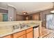 Kitchen featuring stainless steel dishwasher and wood cabinets at 4951 Tuscany Ln, Indianapolis, IN 46254