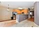 Open concept kitchen featuring stainless steel appliances and breakfast bar at 4951 Tuscany Ln, Indianapolis, IN 46254