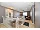 Upstairs landing area with railing overlooking living room featuring neutral walls at 4951 Tuscany Ln, Indianapolis, IN 46254