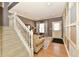 Inviting living room with neutral paint, plush seating, and a patterned rug near staircase at 4951 Tuscany Ln, Indianapolis, IN 46254